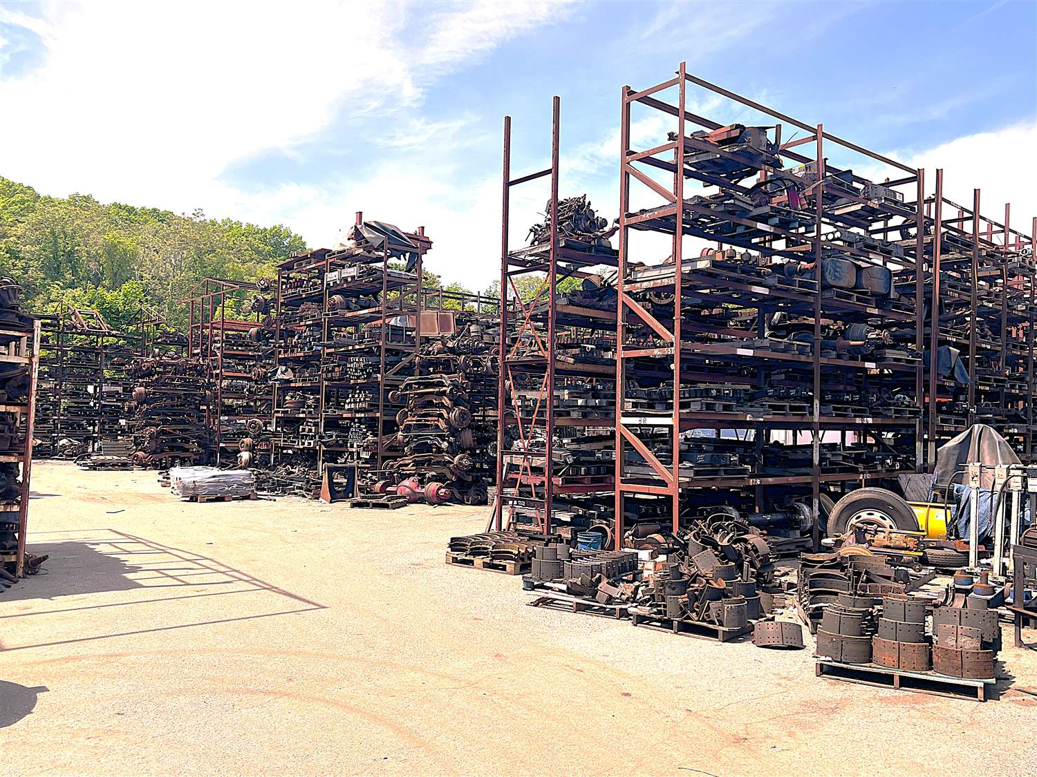 Massive indoor rack storage of heavy-duty truck leaf springs and axles