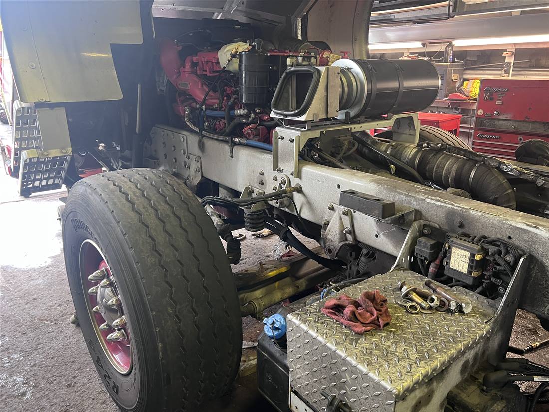 Heavy-duty truck driveline and engine components under repair