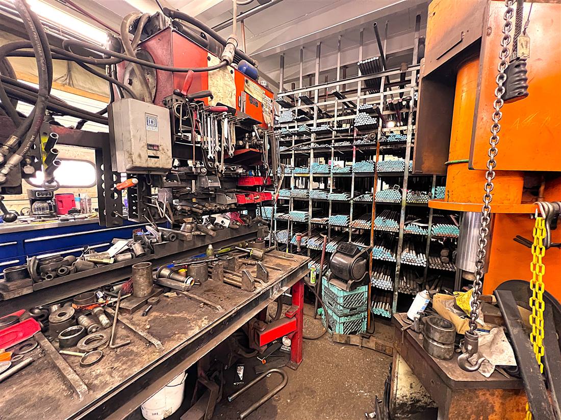 Palmer Spring Company's welding and fabrication shop with racked steel stock